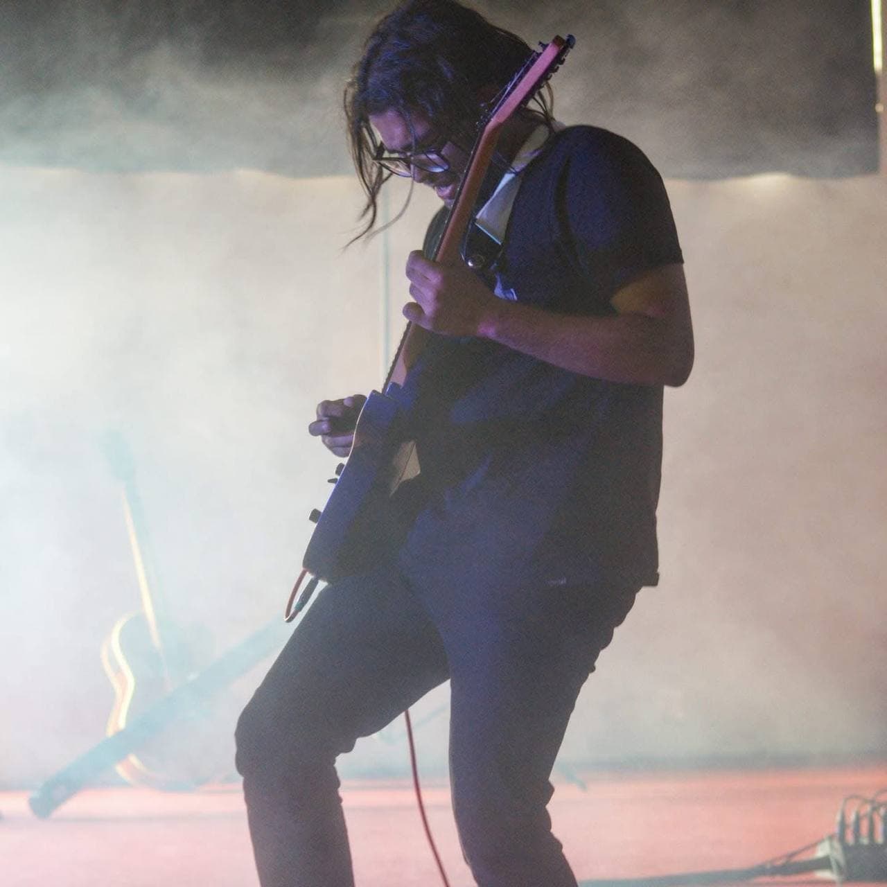 Playing electric guitar on stage